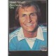 Signed picture of Dennis Tueart the Manchester City footballer. 